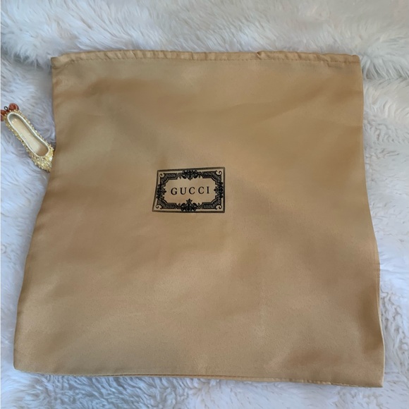 Gucci Handbags - GUCCI smaller drawstring golden tone dust bag VVGUC++